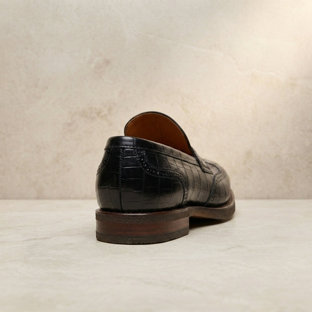 Black Crocodile-Print Leather Garbin Penny Loafer with Natural Leather Sole – heel view
