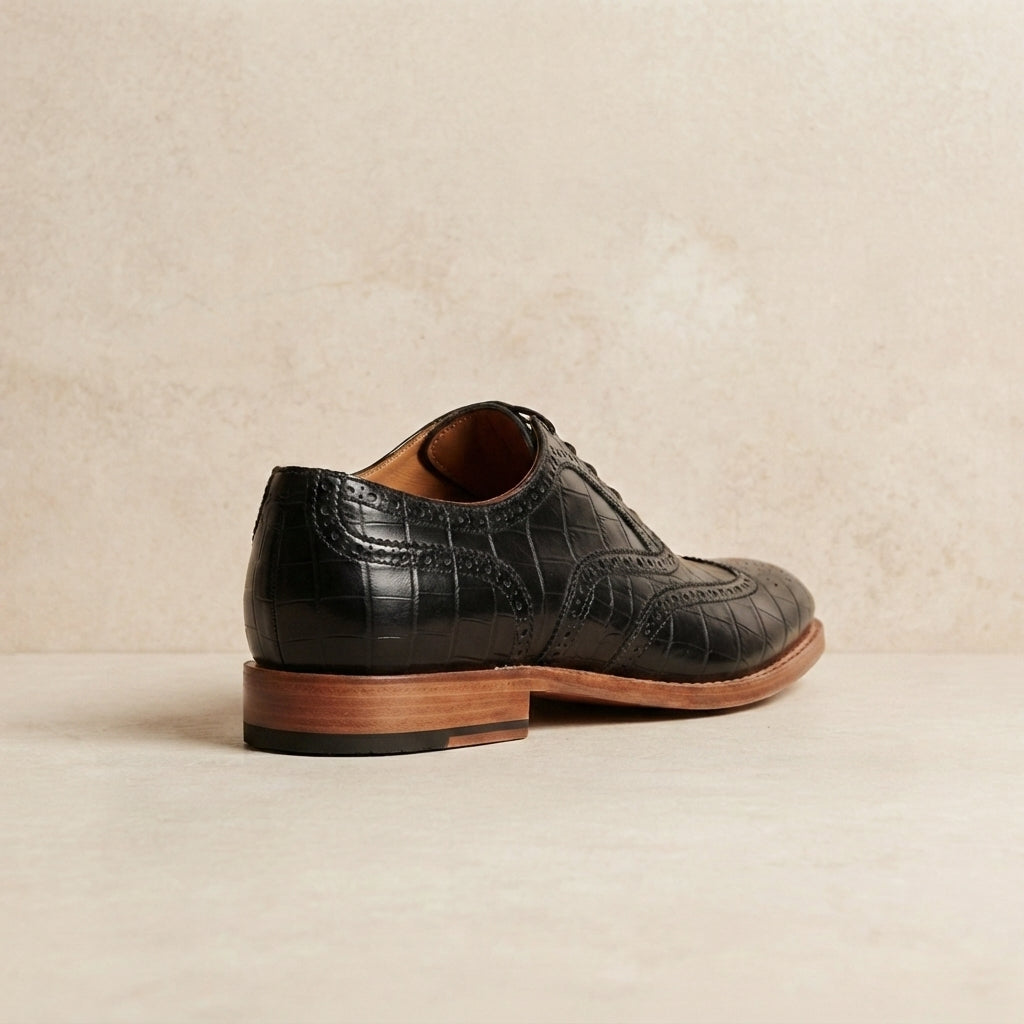 Black Crocodile-Print Leather Libeccio Brogue Ankle Boot with Natural Leather Sole – heel view