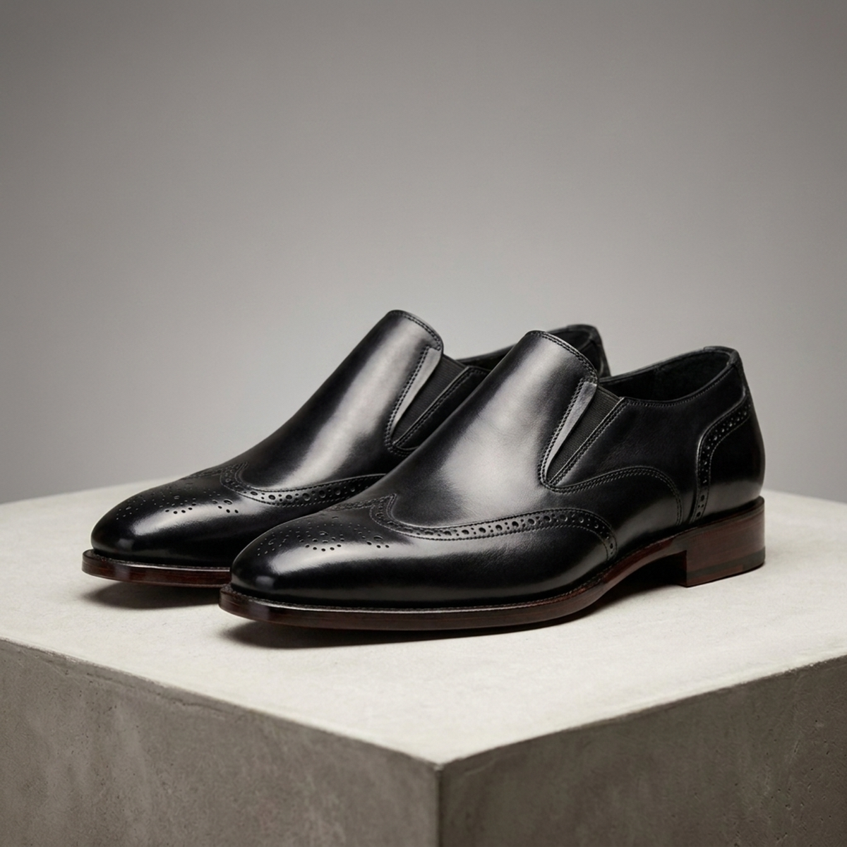 Black Leather Brenta Wingtip Slip-On