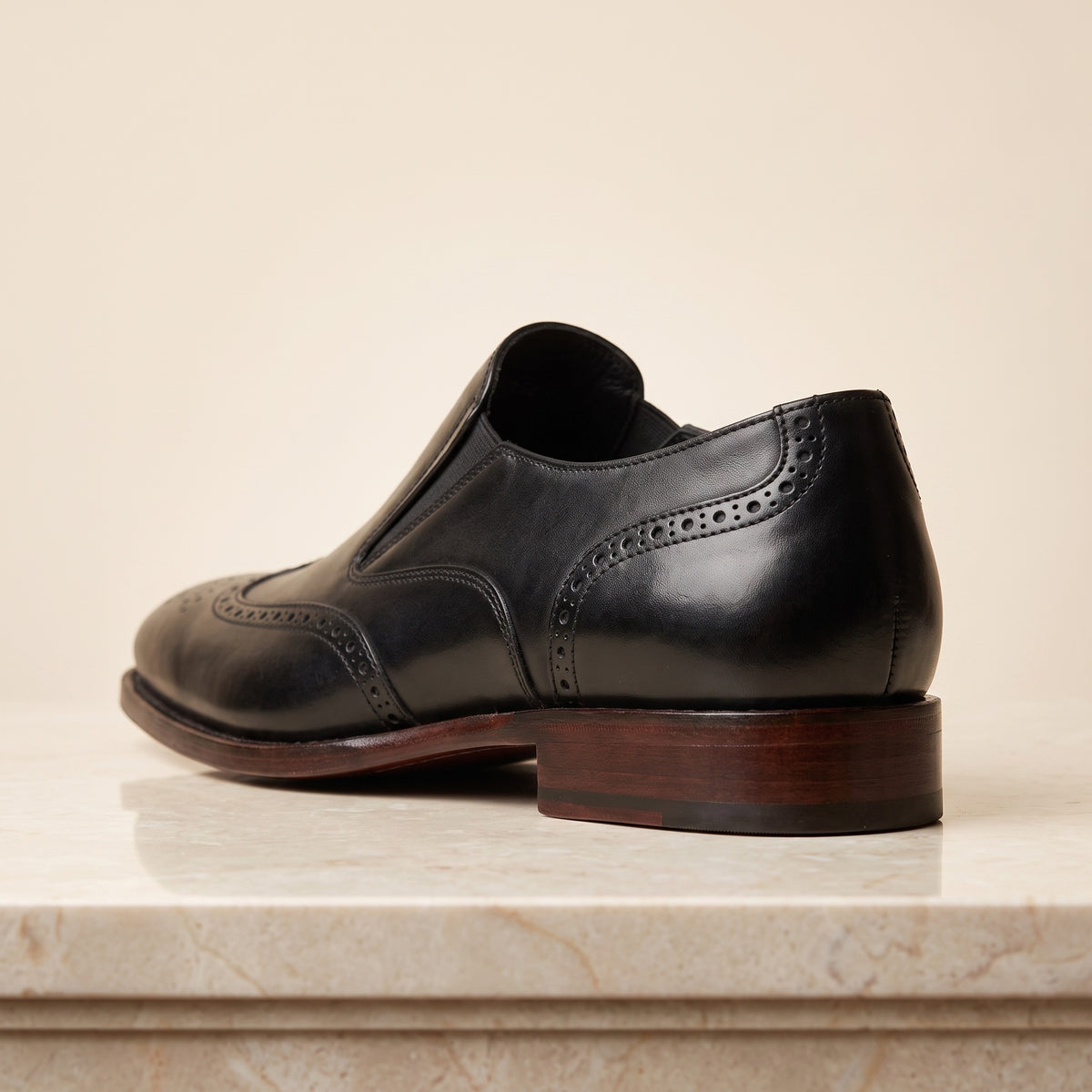 Black Leather Brenta Wingtip Slip-On – back view